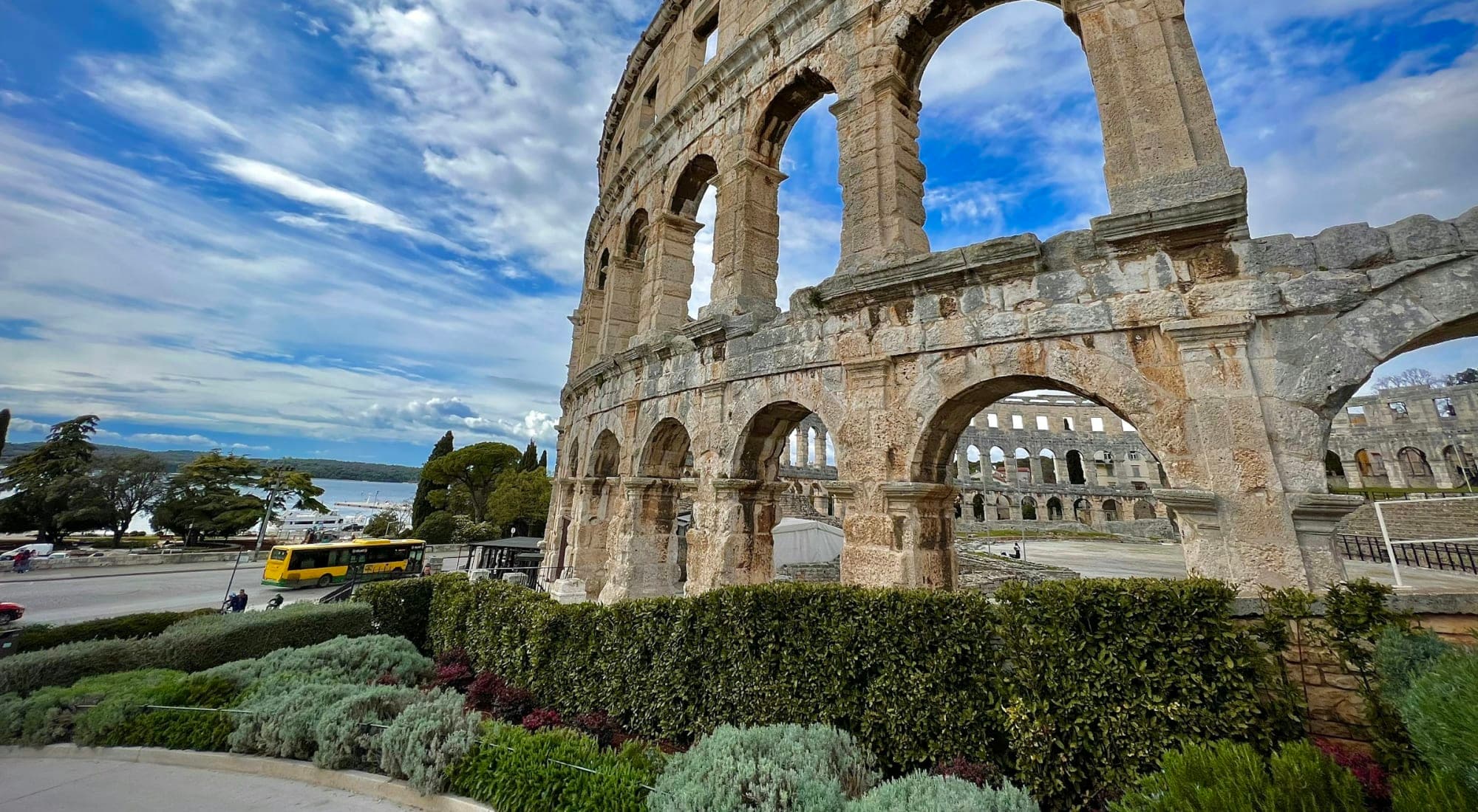 The Roman amphitheatre in Pula, the Arena, with the harbour behind it